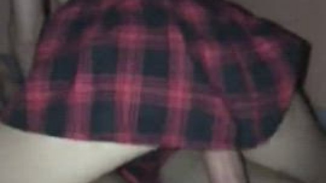 Riding him while wearing a plaid skirt