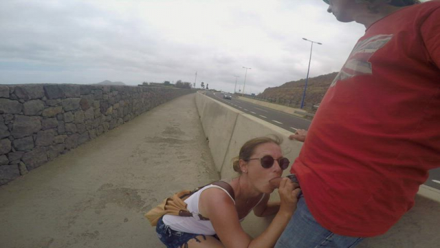Giving him a public fellatio in the highway [GIF]