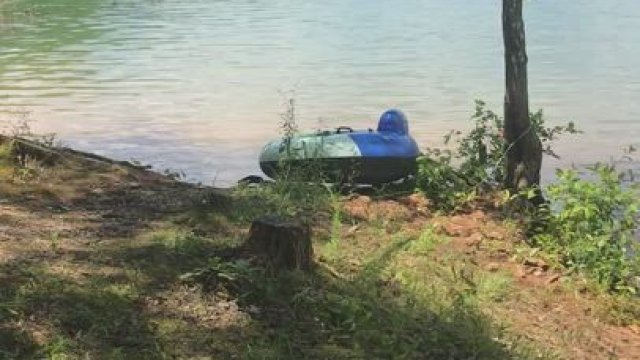 Sucking in a hammock by the lake
