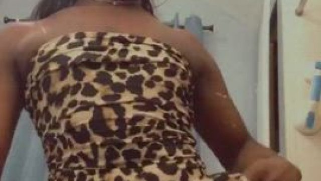 TS GiGi plays in her dress