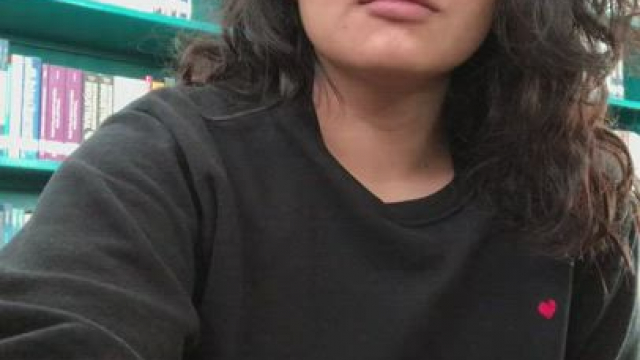 Showing boobs in the library