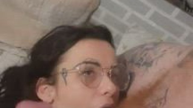 tattooed babe works out a gooey load from a big ginger cock