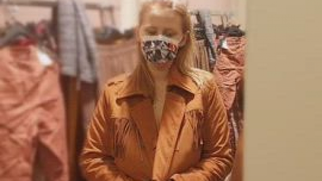 You see a girl in a coat in a changing room in a store and suddenly.... Tadam!