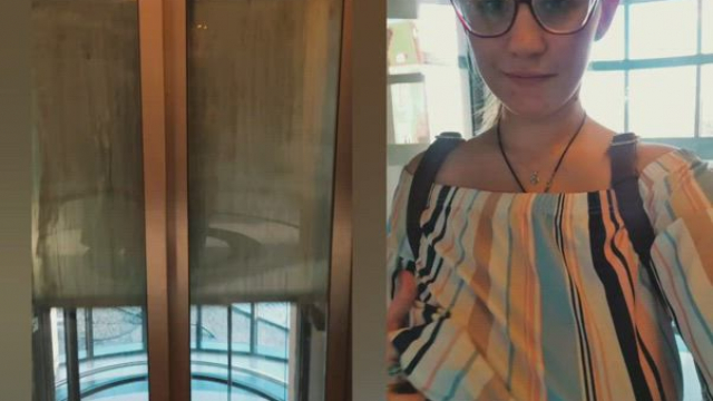 And here I have a little treat. A glass elevator in a shopping mall, me with my 