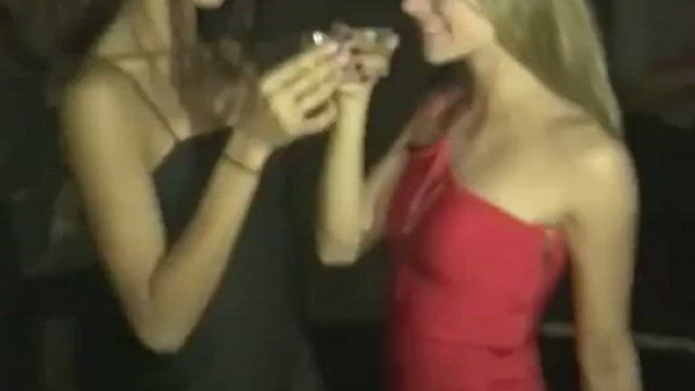 Friends kissing at a party