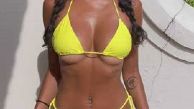 A tiny girl in a bikini