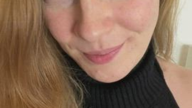 A risky dress for a busty redhead