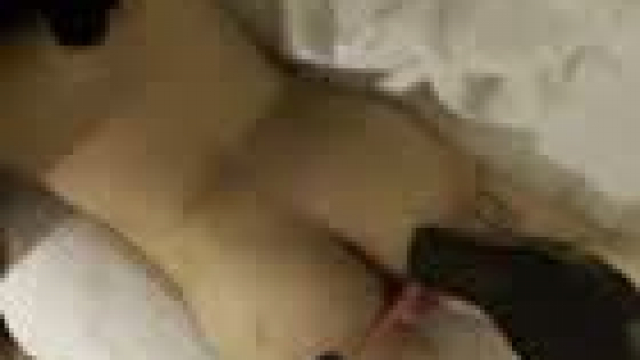 Stroking and licking my tip while she scrolls