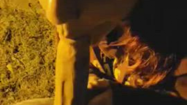 Sucking his massive cock underneath a streetlight