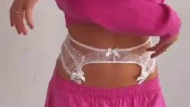 Slowly showing her lingerie