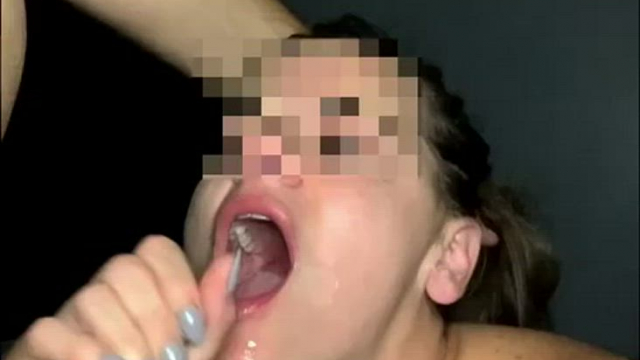 Finishing him with her hands and getting a cumshot all over her face