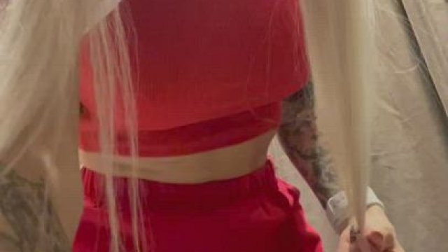 in the dressing room of a shopping center))