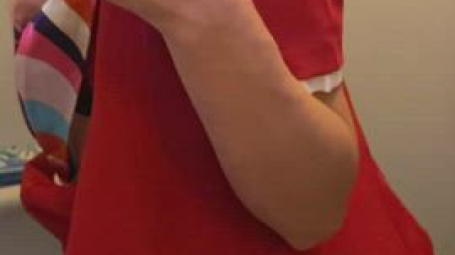 Naked flight attendant in the lavatory of an airplane during a night flight. Ori