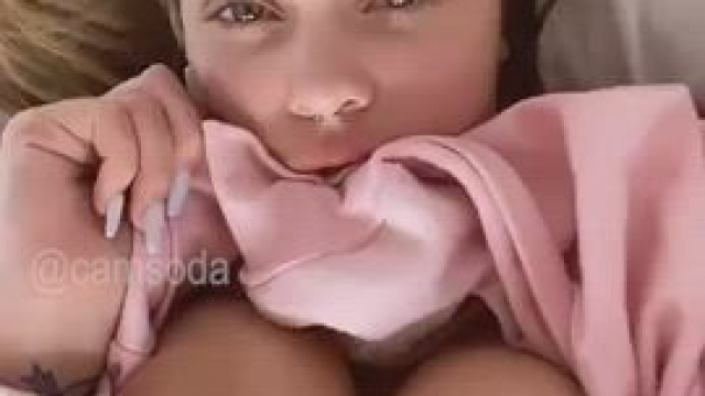 Biting Her Pink Blouse