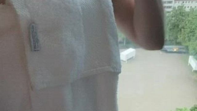 Towel drop in front of the big hotel room window hoping someone saw.