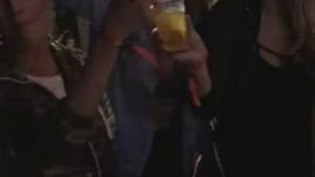 Man bangs his mates at a concert