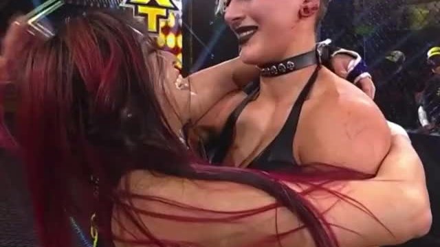 Rhea Ripley giving Io Shirai's ass a few smacks
