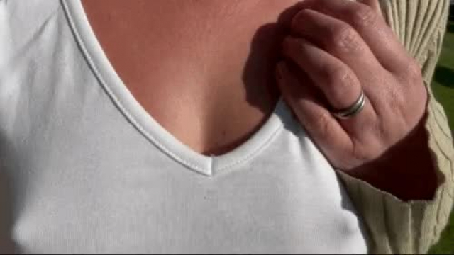 Showing off my banded nipples in the park.