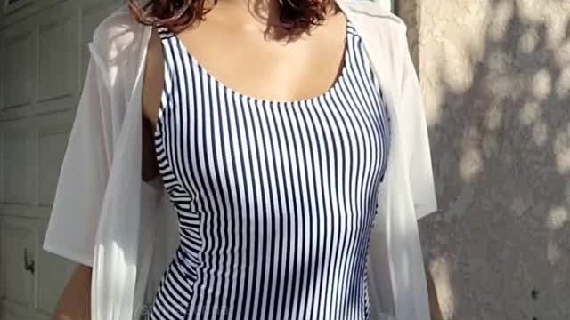 Trying to get some sun in my striped swimsuit