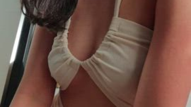 I think it is the smile.. oh no wait! The dress..?