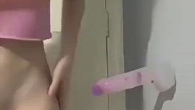 This girl likes to split and play with the dildo on the wall