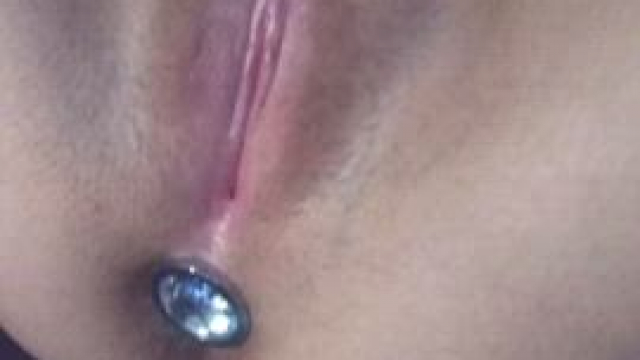 Good girls play with their buttplug by fingering their pussy.