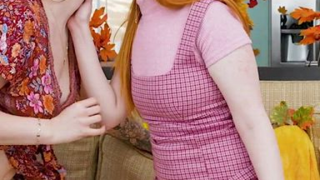 Redheaded sisters kissing