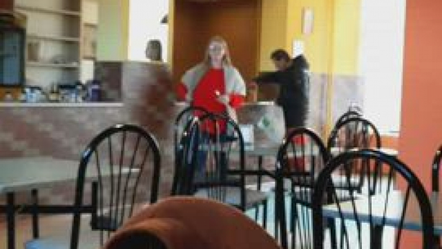 The gentleman was so busy packing a take-out lunch that he didn't even notice th