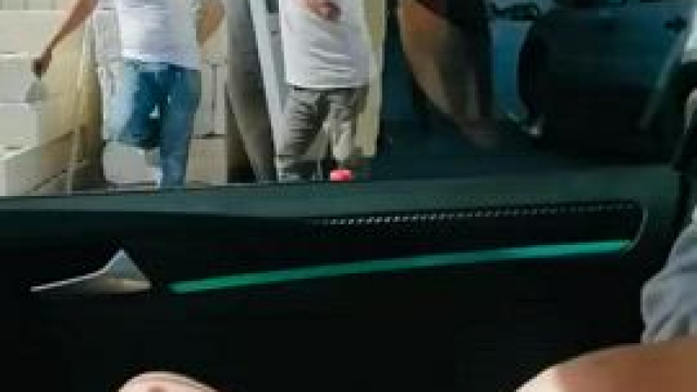 Flashing her big tits from the car to strangers