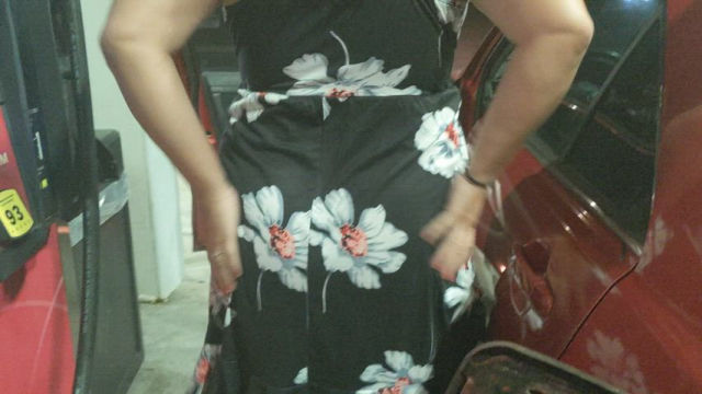 Mature mother showing off my butt plug while pumping gas