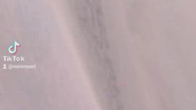 Indian woman performing on her balcony