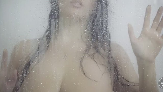 Pressing herself up against the glass