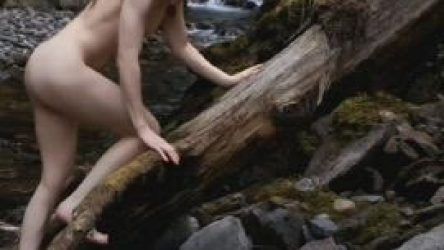 Climbing the log for a better view of this new off-trail waterfall