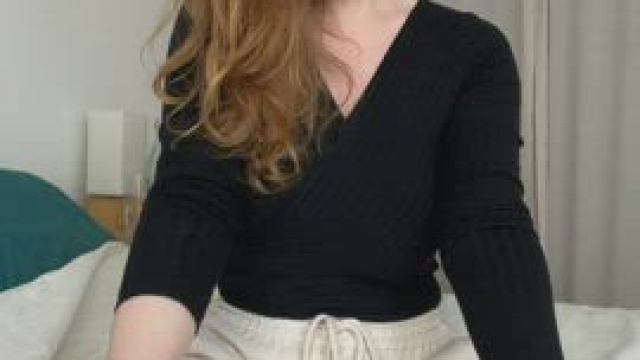 Surprise! There's a busty redhead on your bed!