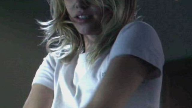 Mircea Monroe taking her shirt off in Bloodwork