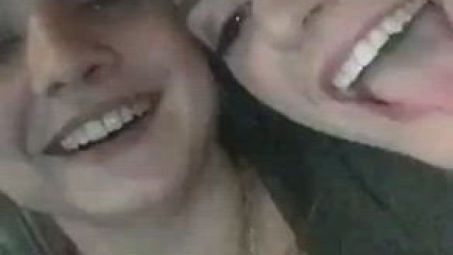 Squeezing her massive tits.