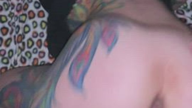 Couple in a field surrounded by houses