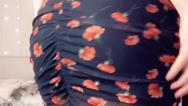 Lifting up my dress to show off my big ass and a surprise hiding between my chee